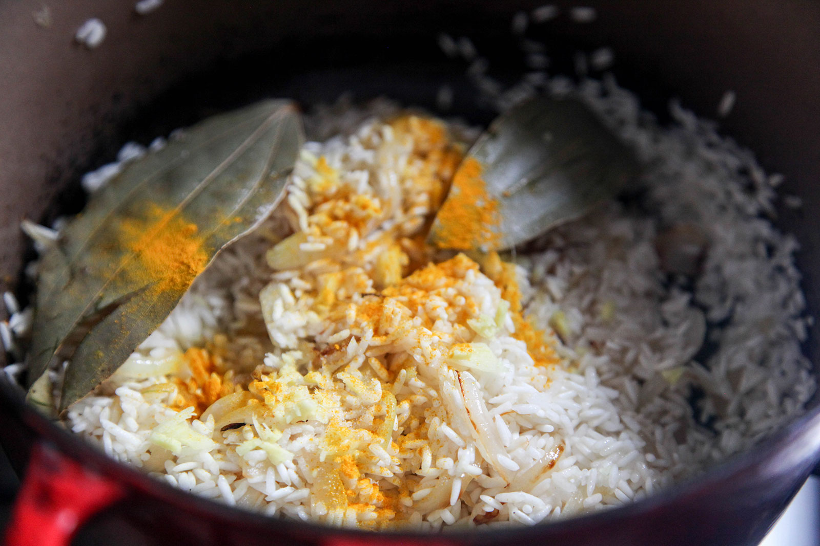 Frying sticky rice with spices for Sylheti Biron Polau