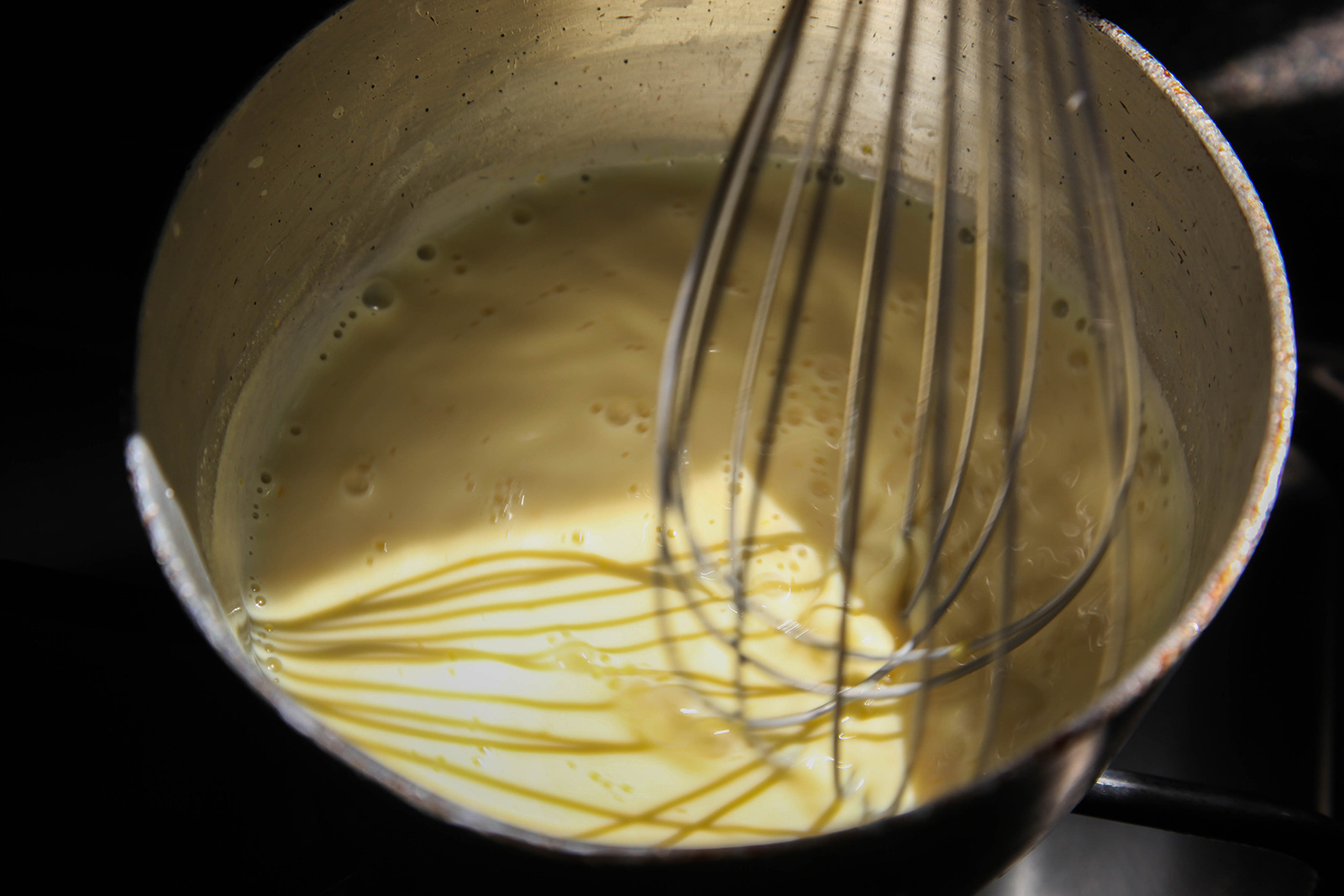 Whisking custard over low heat, in prep for strawberry cake