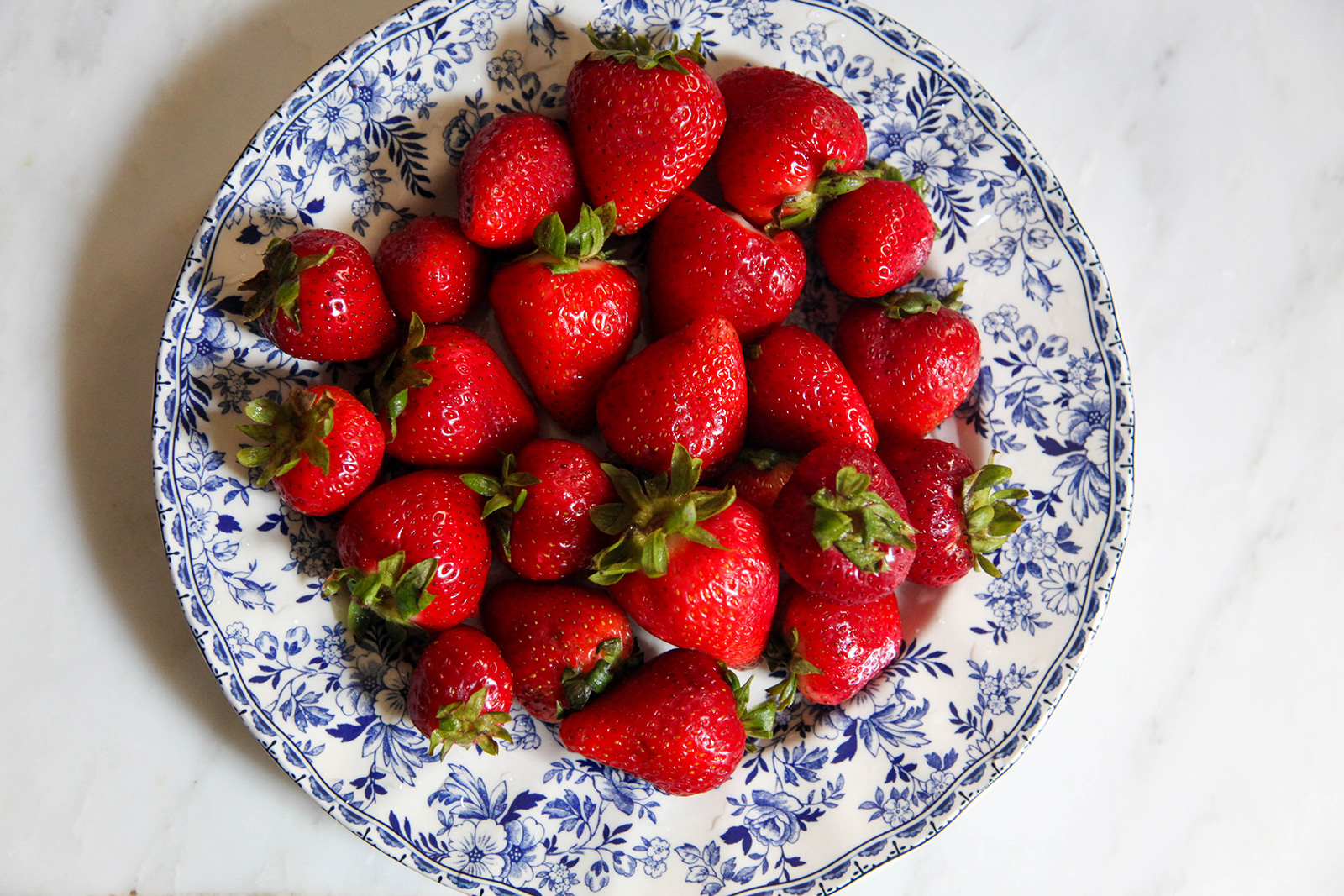 Fresh strawberries on a plate, to be used on strawberry cake