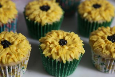 moist fluffy cupcakes with buttercream sunflower decoration