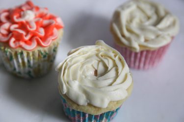 moist fluffy cupcakes with white rosette decoration