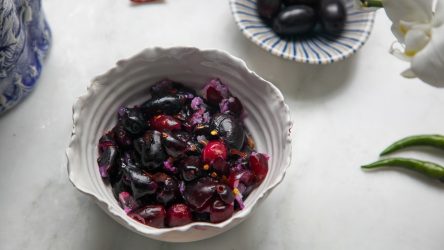 Jaam Bhorta or Black Plum Salsa in a bowl, and a small bowl or Jaam in the background