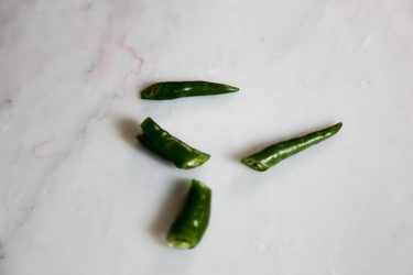 green chilies, sliced in half