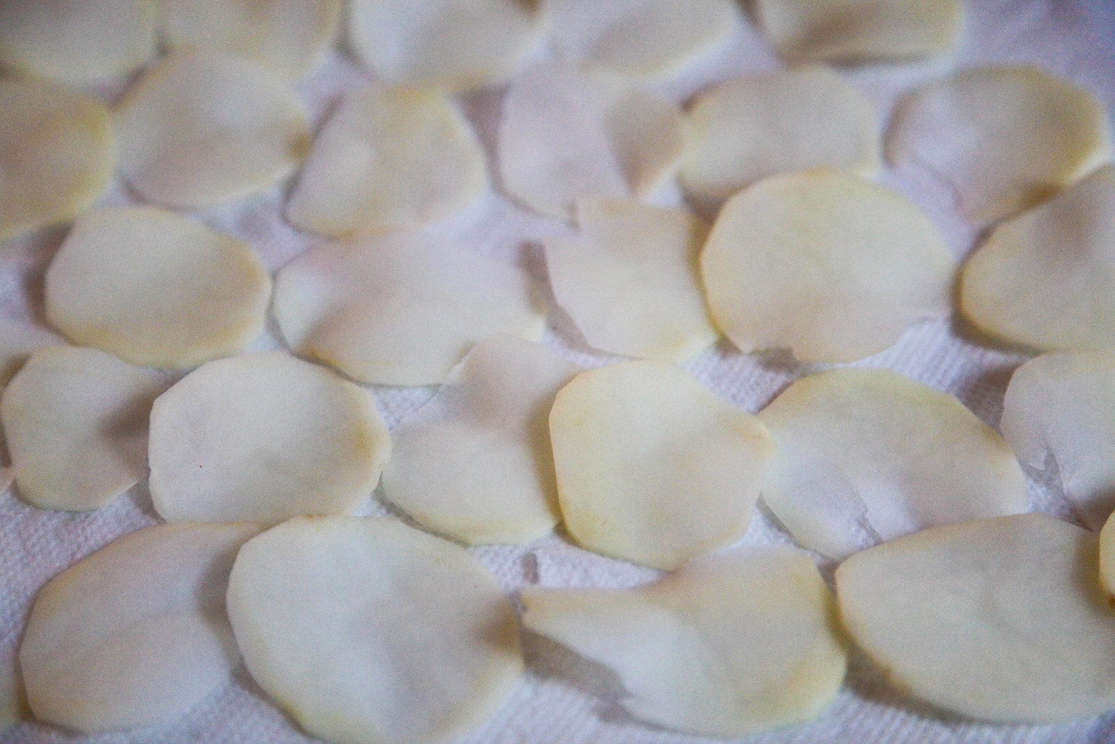 potato slices drained of water, and dried on paper towels