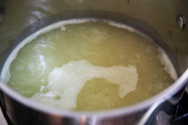 Boiling stock for Savory Oatmeal with leeks, shiitake mushrooms, and spinach