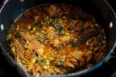 Sheem Bichi diye Maach - Bangladeshi Fish Curry with Hyacinth Bean Seeds. Cooked in a pot and ready to serve