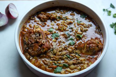 Sheem Bichi diye Maach - Bangladeshi Fish Curry with Hyacinth Bean Seeds. Served in a bowl