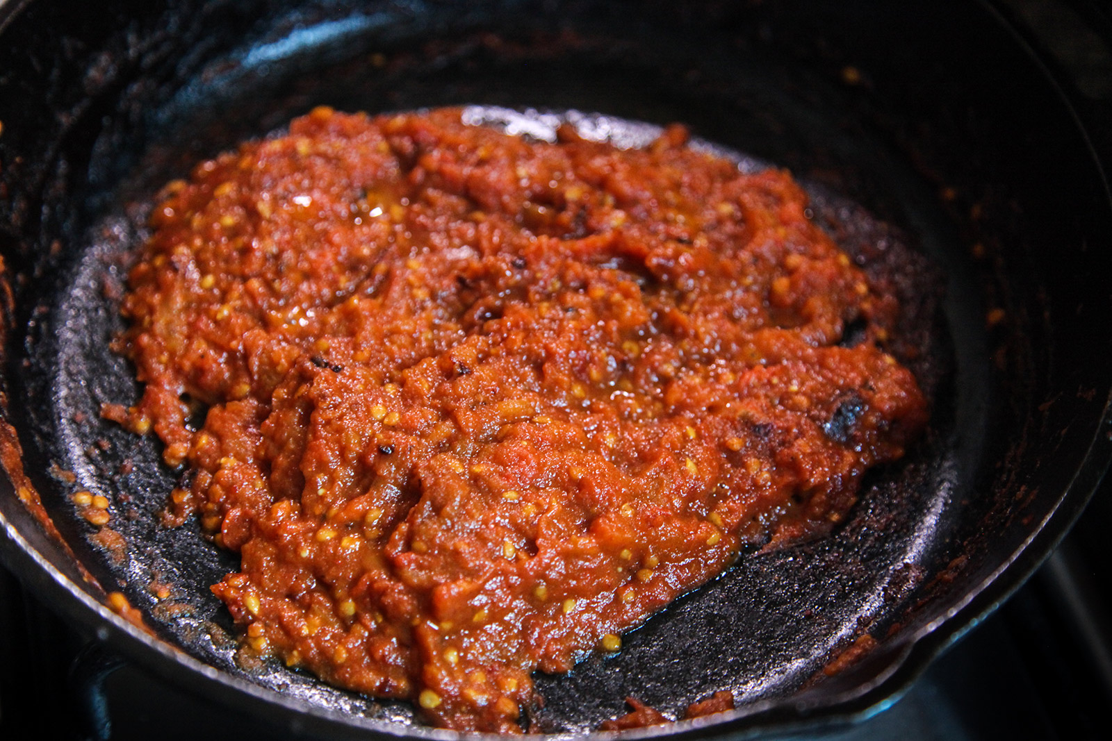 Cooked down smashed tomatoes in pan with no excess liquid