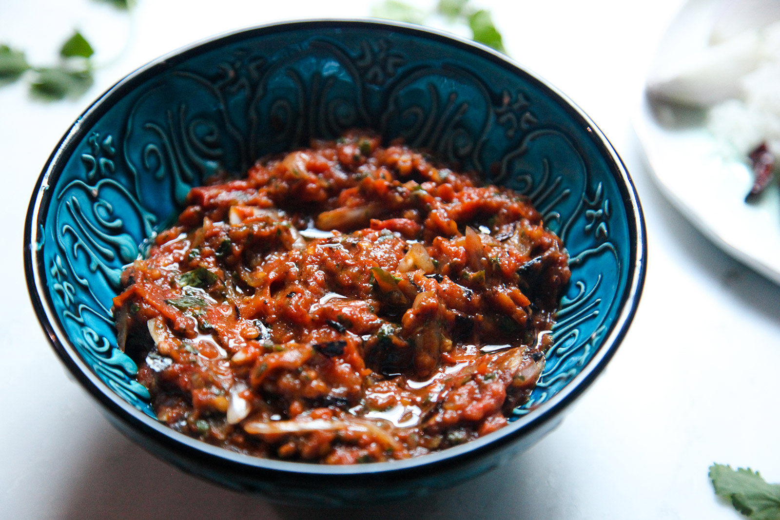 Tomato Bhorta in a dish, ready to serve