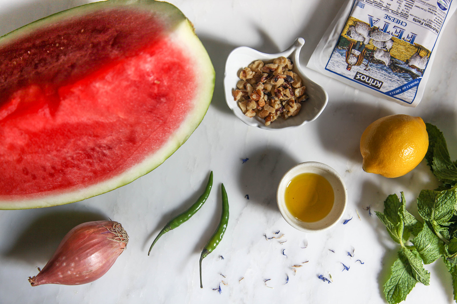 Ingredients for making Watermelon Salad with Mint, Feta, Walnuts & a Little Bit of Spicy Kick